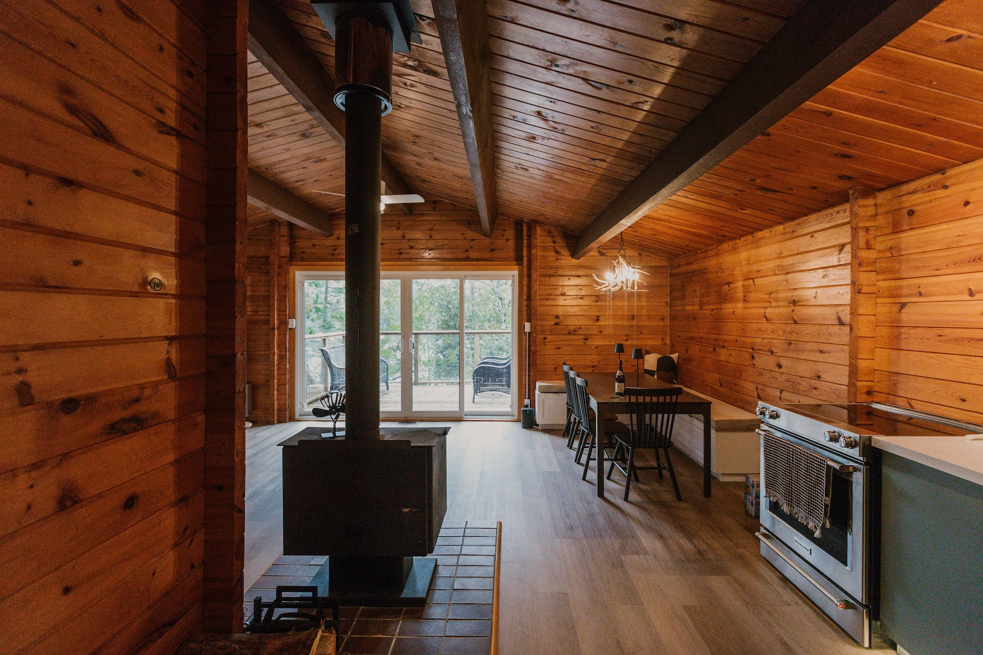 Wood stove and open-plan living and kitchen area