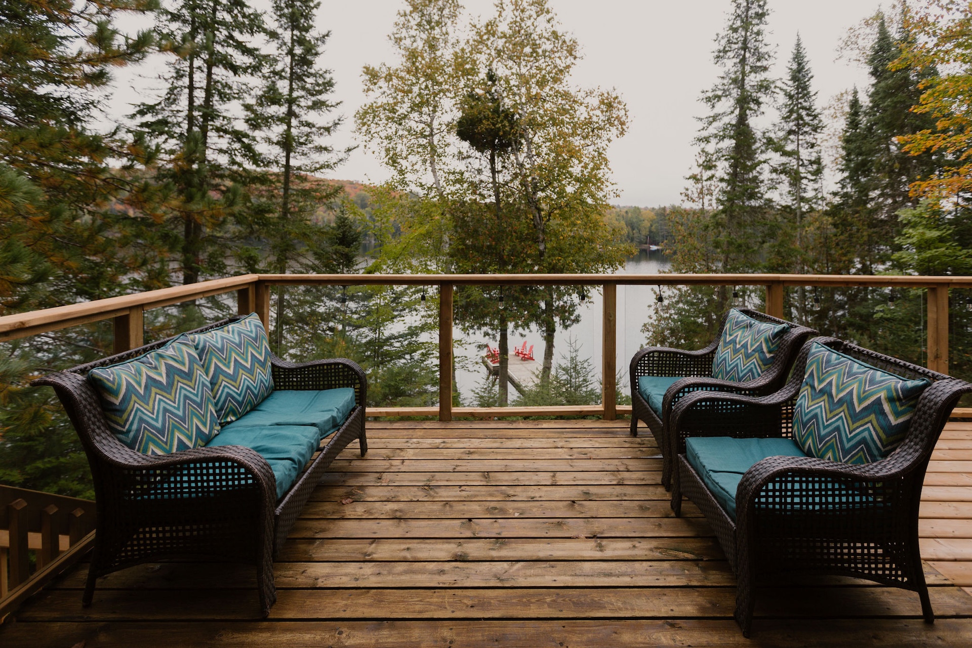 Deck with wicker chairs overlooking the lake