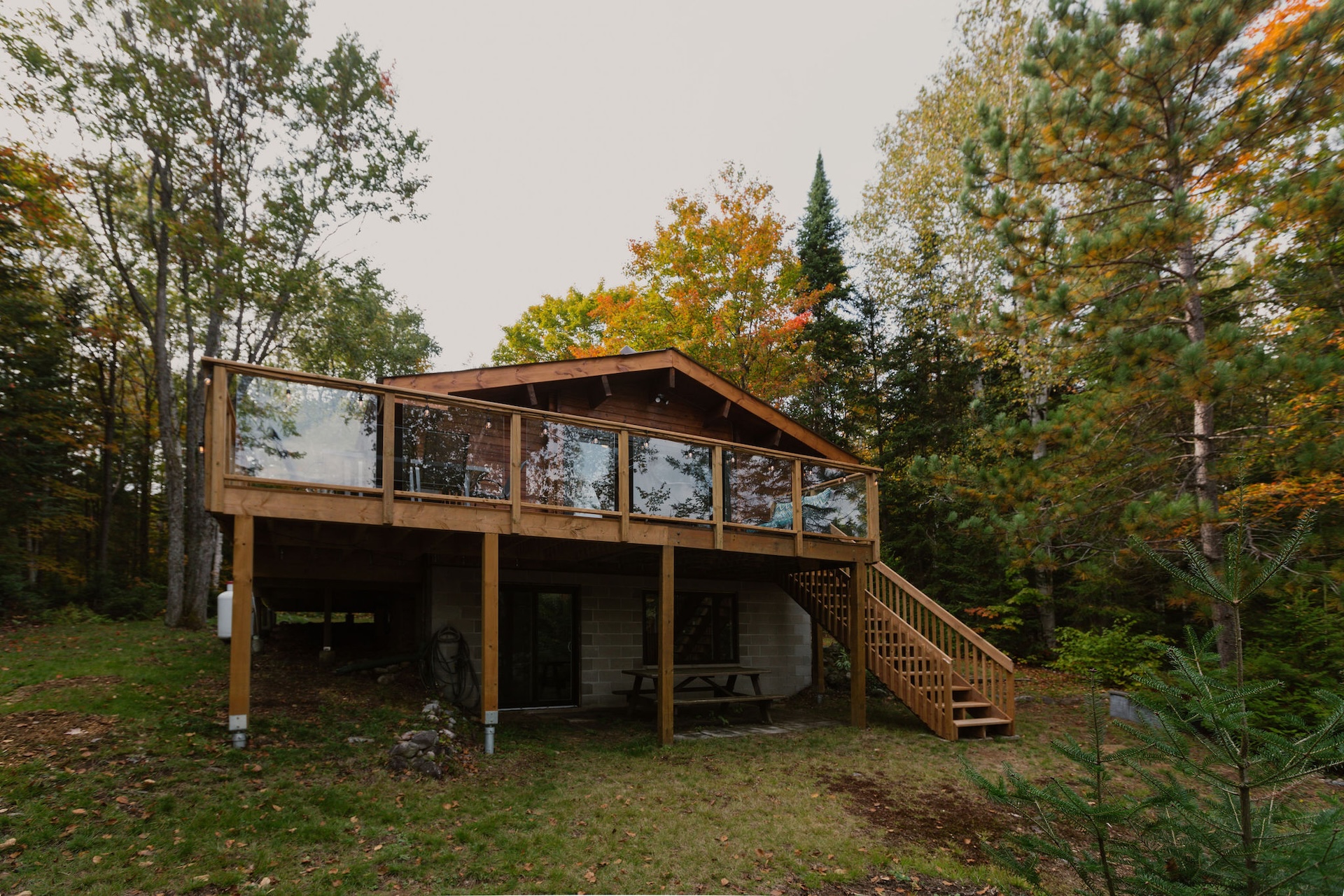 Exterior of The Silver Clam cottage with deck and stairs